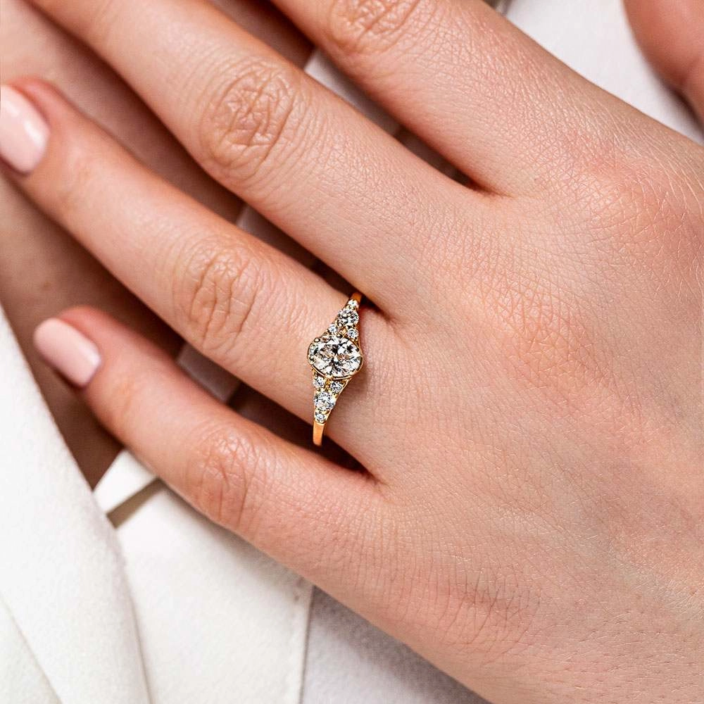 Unique Bauble Amira Oval Lab Grown Diamond Six Prong Side Stone Engagement Ring