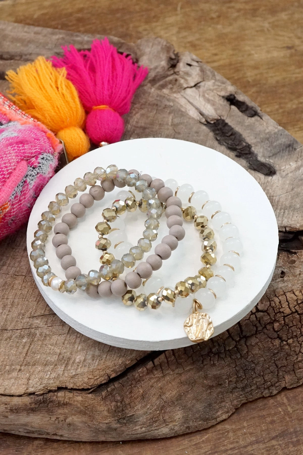 Cultural Perspective Beaded Bracelets set in White and Gray with a coin charm
