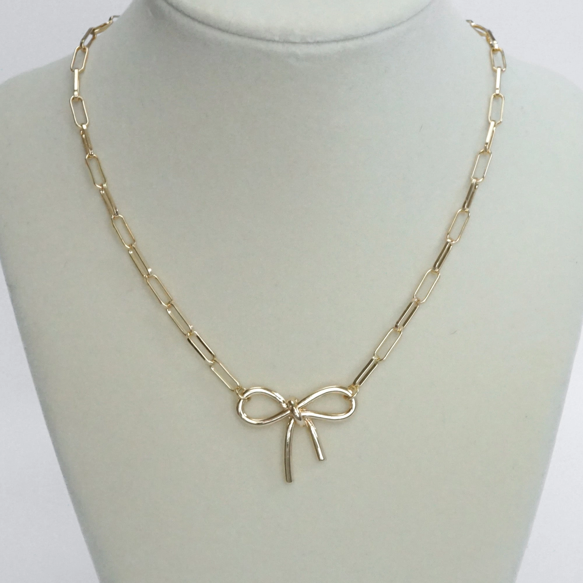 Social Accessory Bow Necklace - Short dainty paperclip chain in gold tone