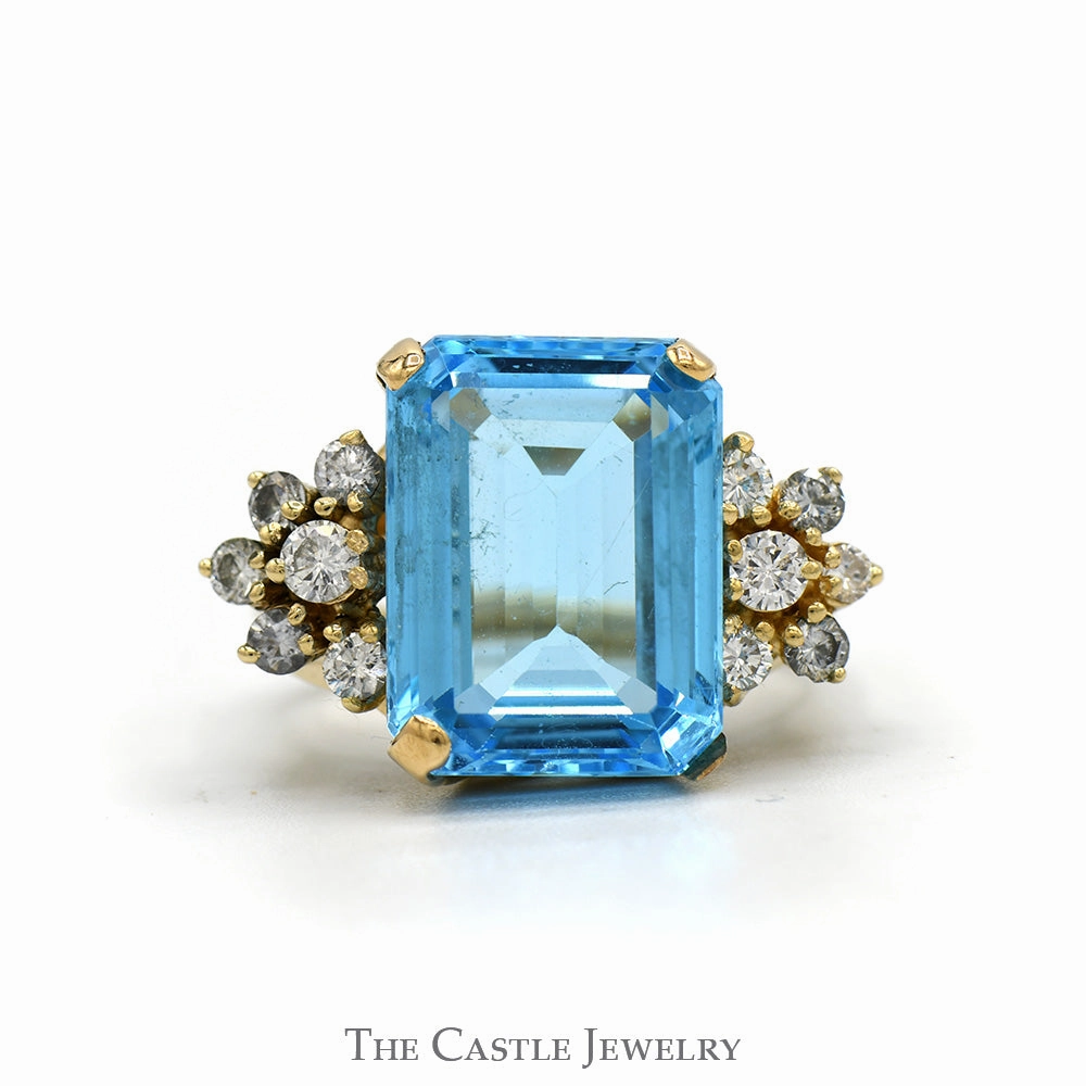 Emerald Cut Blue Topaz Ring with 1/2cttw Diamond Cluster Sides in 14k Yellow Gold Symbolic Form