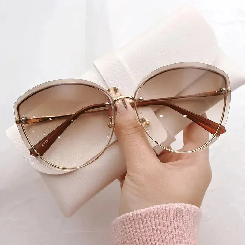 High Quality women's Oval Rimless Sunglasses Lady Metal Cay Eye Shades for Women Driving Glasses Sonnenbrille zonnebril dames