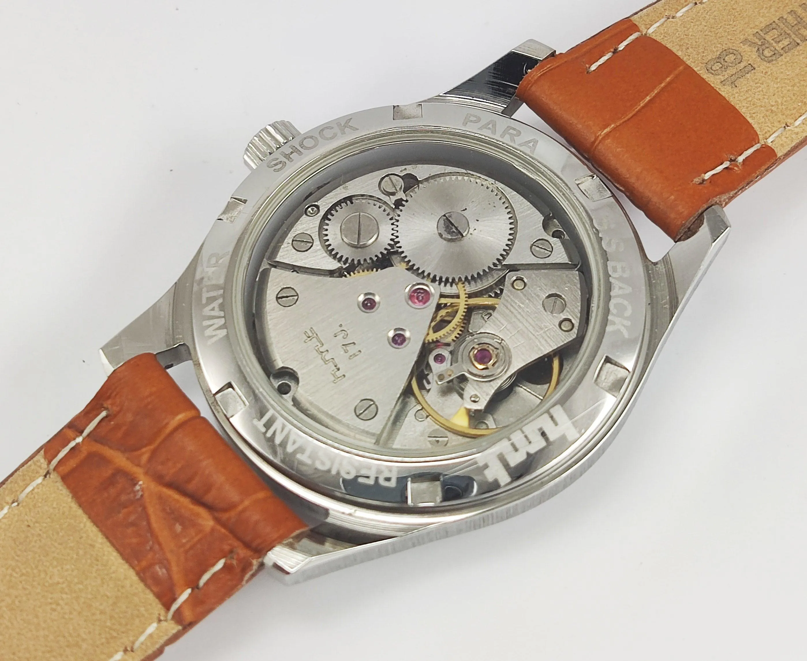HMT Janata Para Shock 17 Jewels Red Urdu / Arabic Dial Transparent Back Mechanical Hand winding Men's Wrist Watch