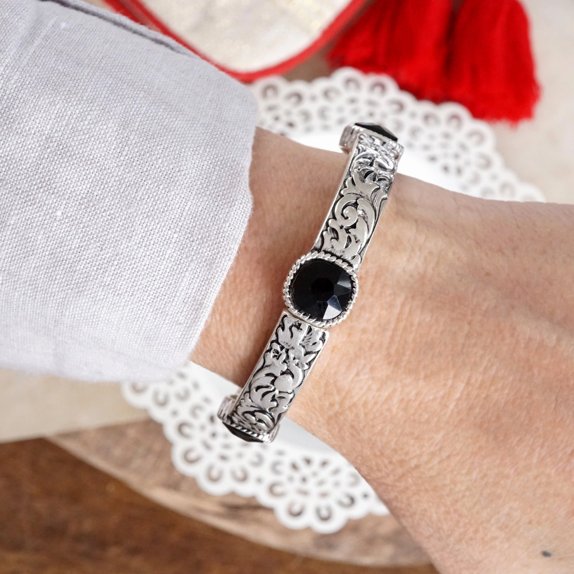 Classic Silver Tone Filigree Station Bangle with Black Stone Accents Harmonious Detail Heartwarming Blends