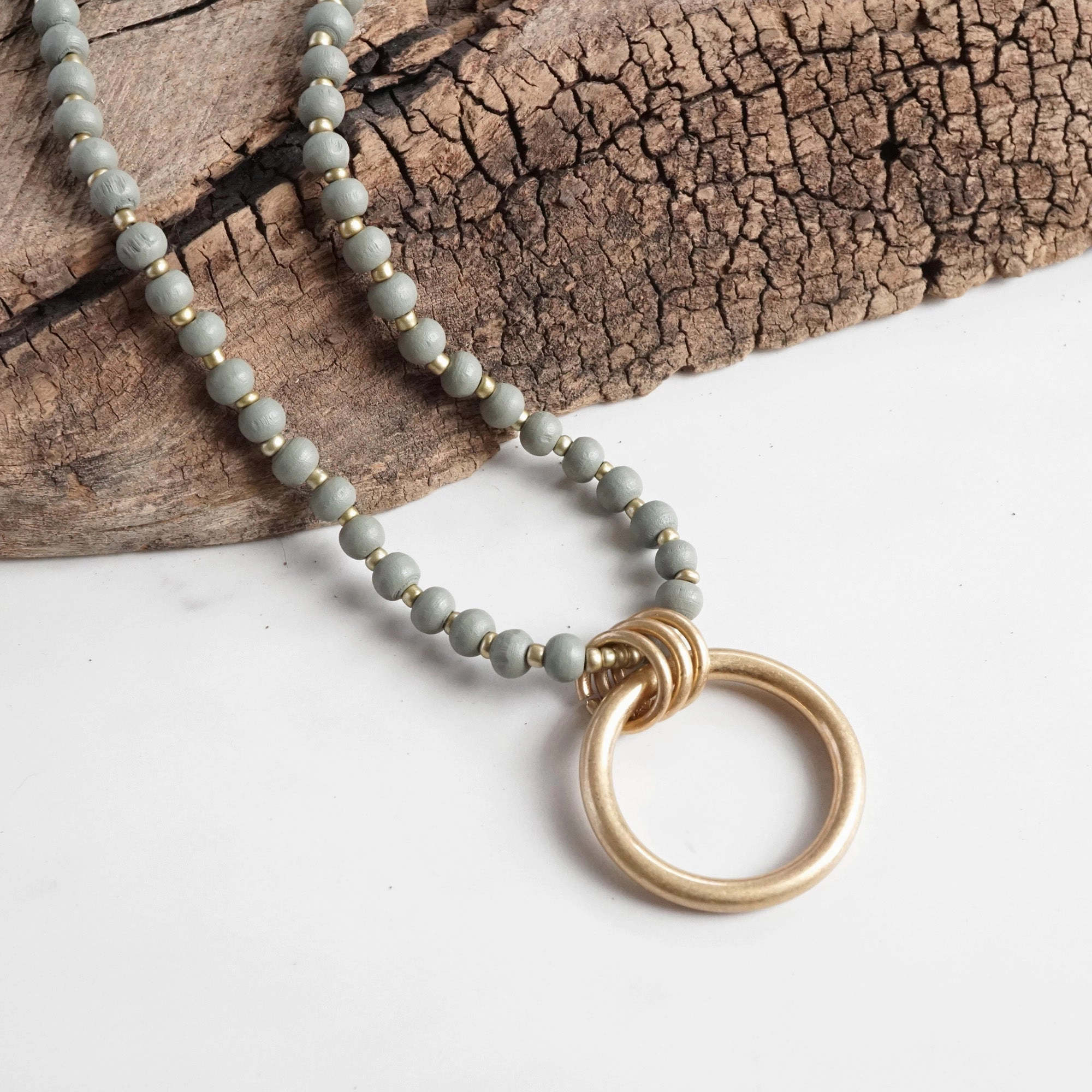 Subtle Shine Knotted Piece Long Wooden Bead Necklace with gold circle ring - Grey