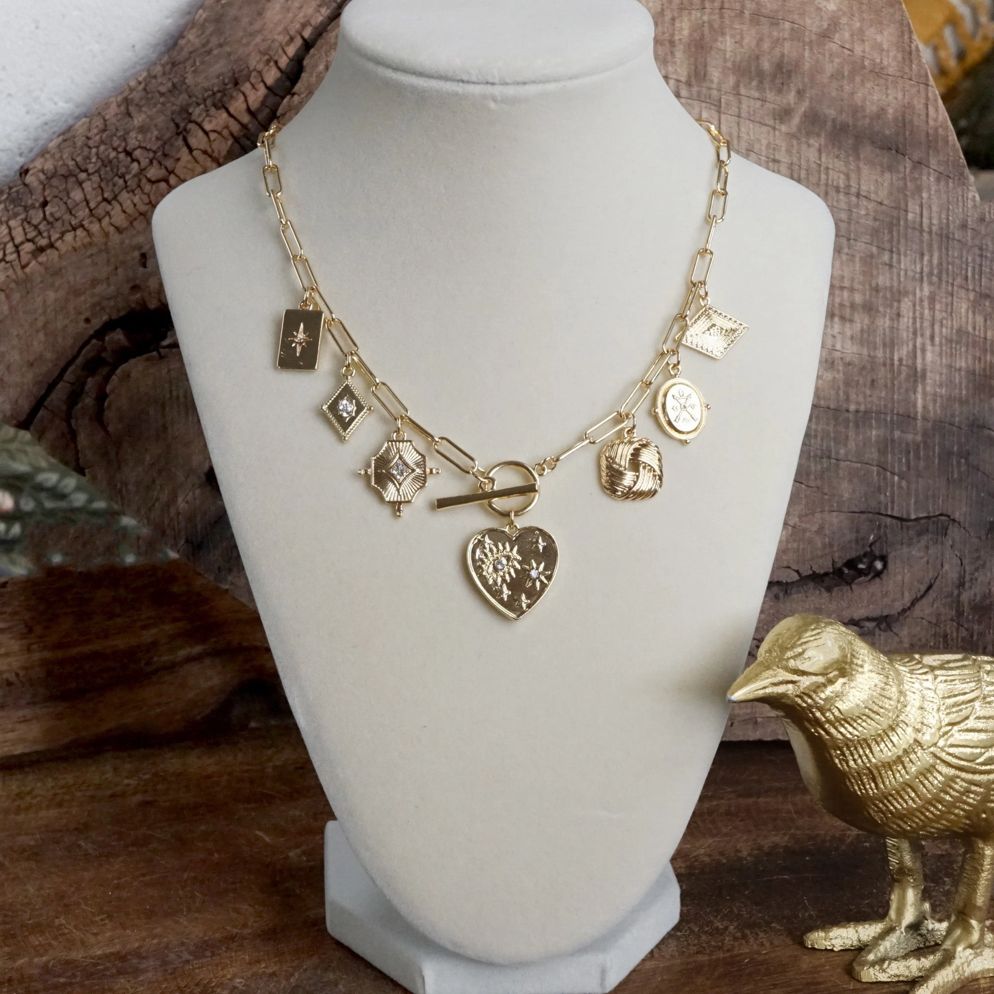 Classic Appeal Value Piece Multi-Charm Statement Necklace with Front Toggle & Heart Crystals ?C Gold Tone