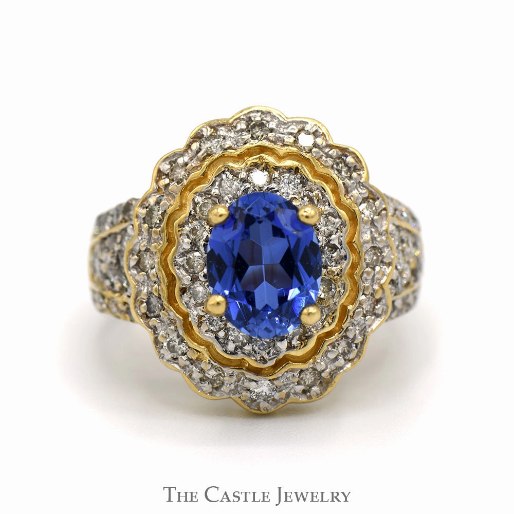 Oval Tanzanite Ring with 3/4cttw Diamond Accented Sides and Halo in 14k Yellow Gold Meaningful Statement