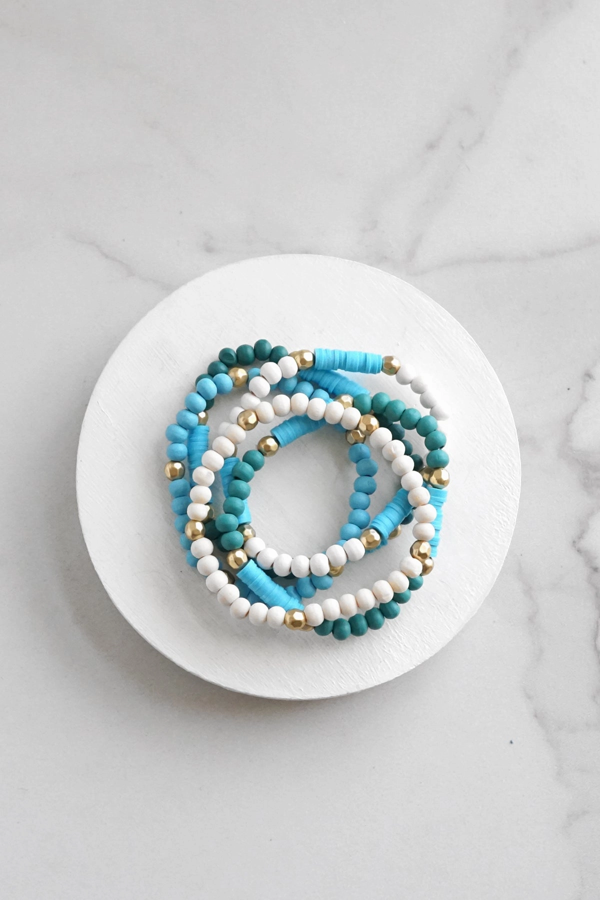 Blue stack of 5 clay and wood beads bracelets in blues and white Favorable Combinations