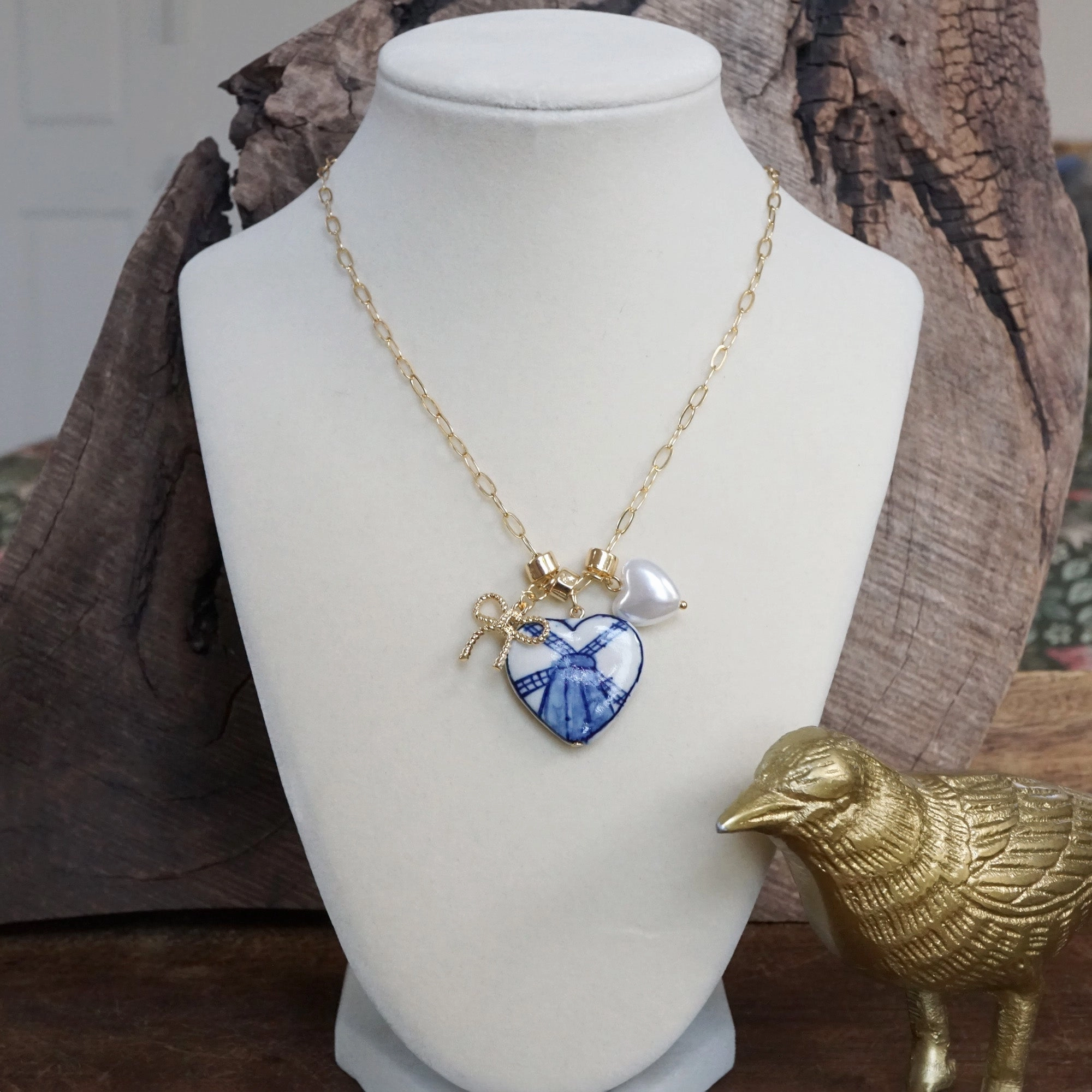 Multi-Charm Chinoiserie Heart & Bow Necklace ?C Blue & Gold Adorned Piece