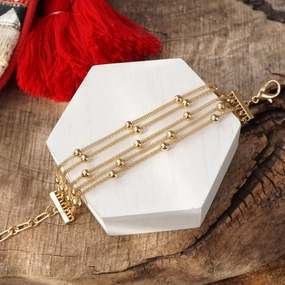 Significant Contribution Multi Chain Bracelet with ball beads in gold tone